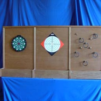 Stand tir et lancer - 
But : 3 activités : lancer d’anneau, lancer de fléchettes et tir. 